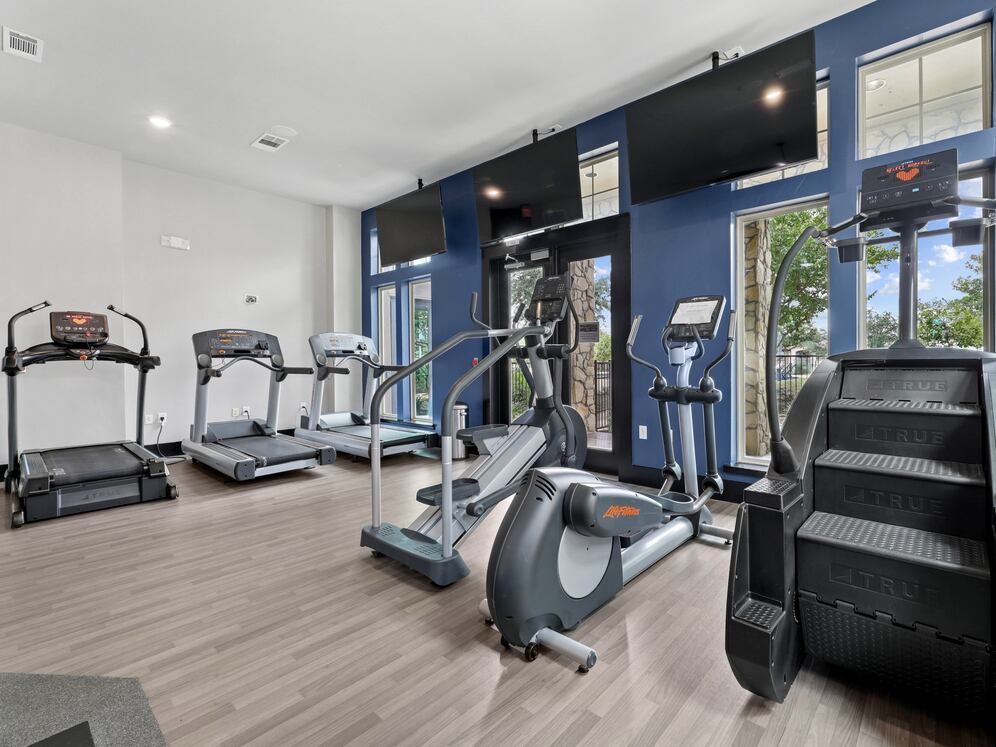 State-of-the-art fitness center with cardio equipment