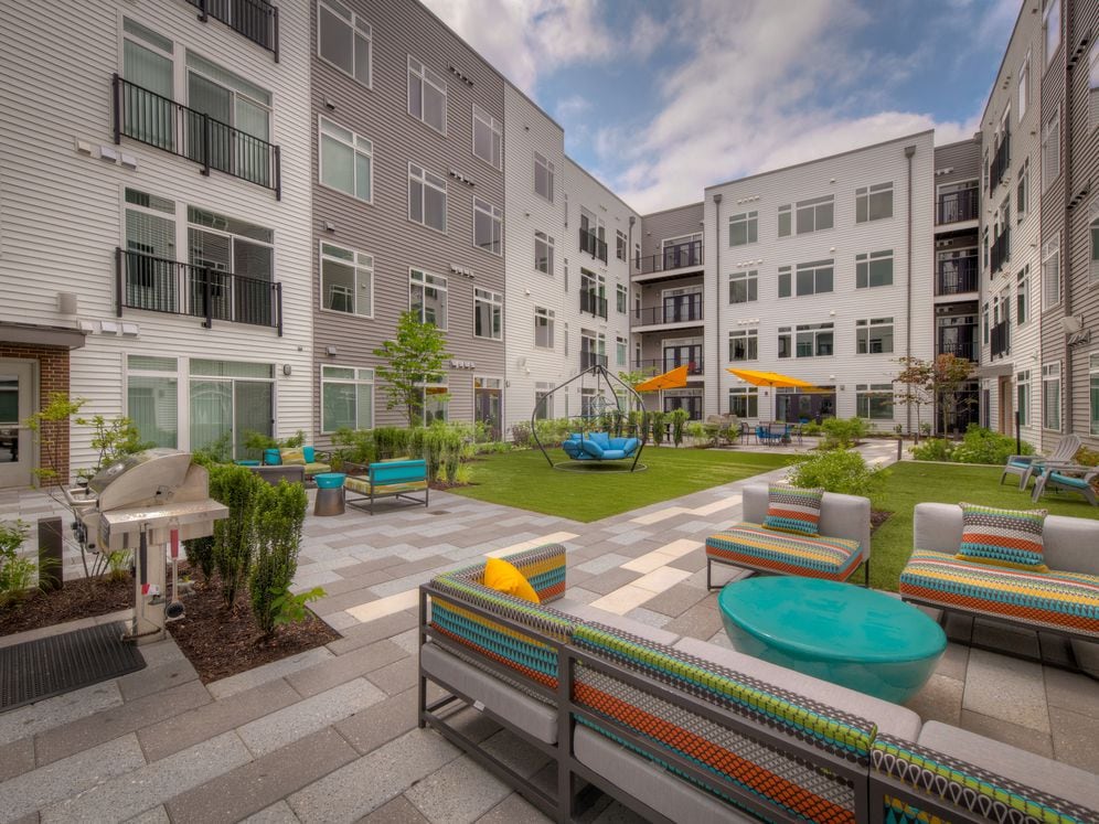 Outdoor chill lounge with barbecue grill and lounge seating