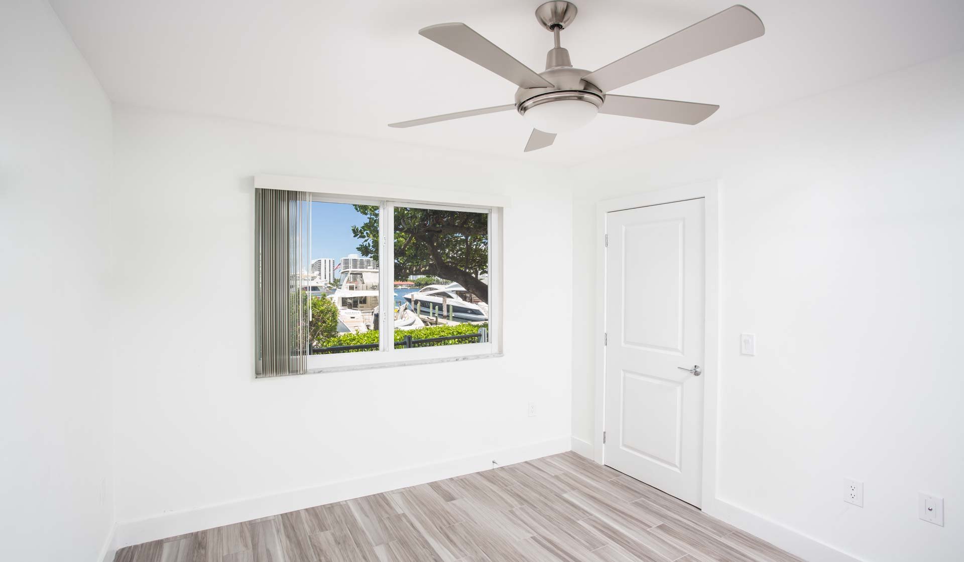 Master bedroom features great views and wood flooring throughout
