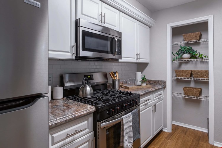 This beautifully updated kitchen features sleek stainless steel appliances and ample cabinetry—offering both style and functionality for everyday living.