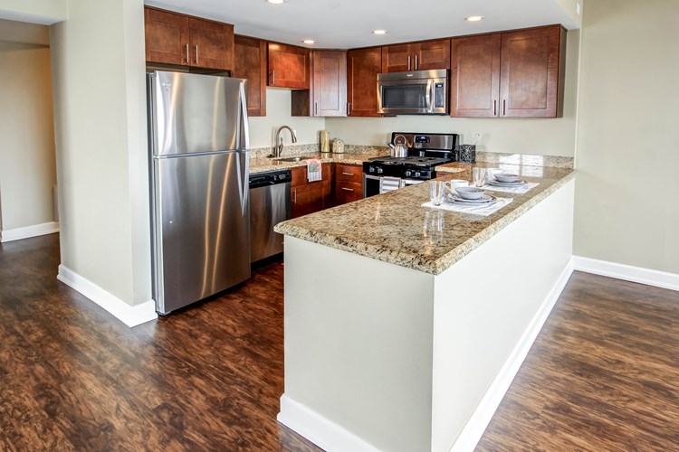 Upgraded Kitchens with granite, stainless steel and new cabinets in select units