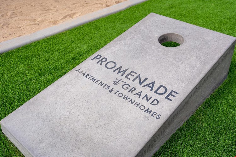 Play a game of cornhole while you watch the kids run free on the playground.