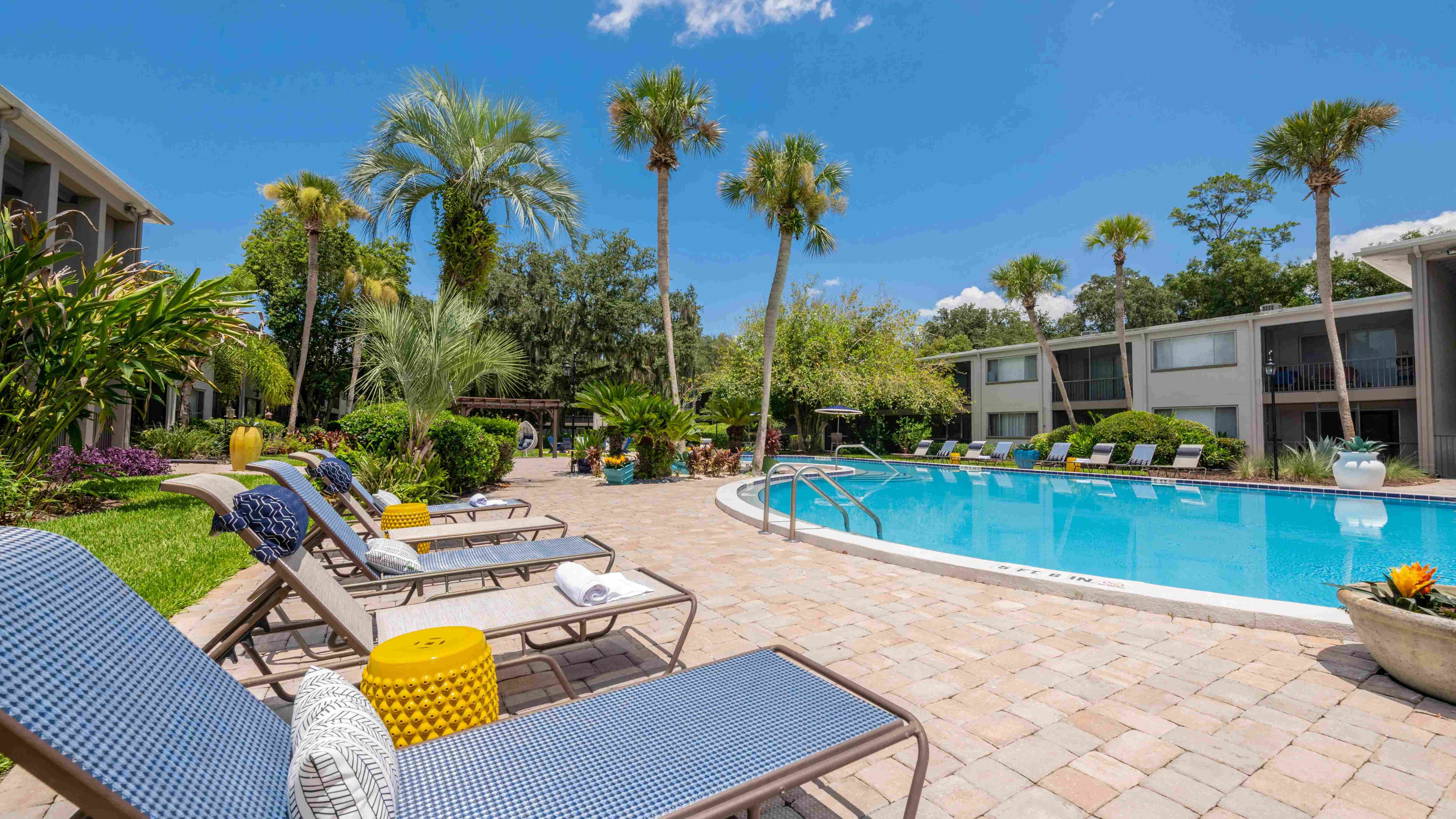 Immerse yourself in pure joy at our sparkling swimming pool—where lush greenery meets an abundance of inviting loungers, enticing you to take the plunge into pure bliss.