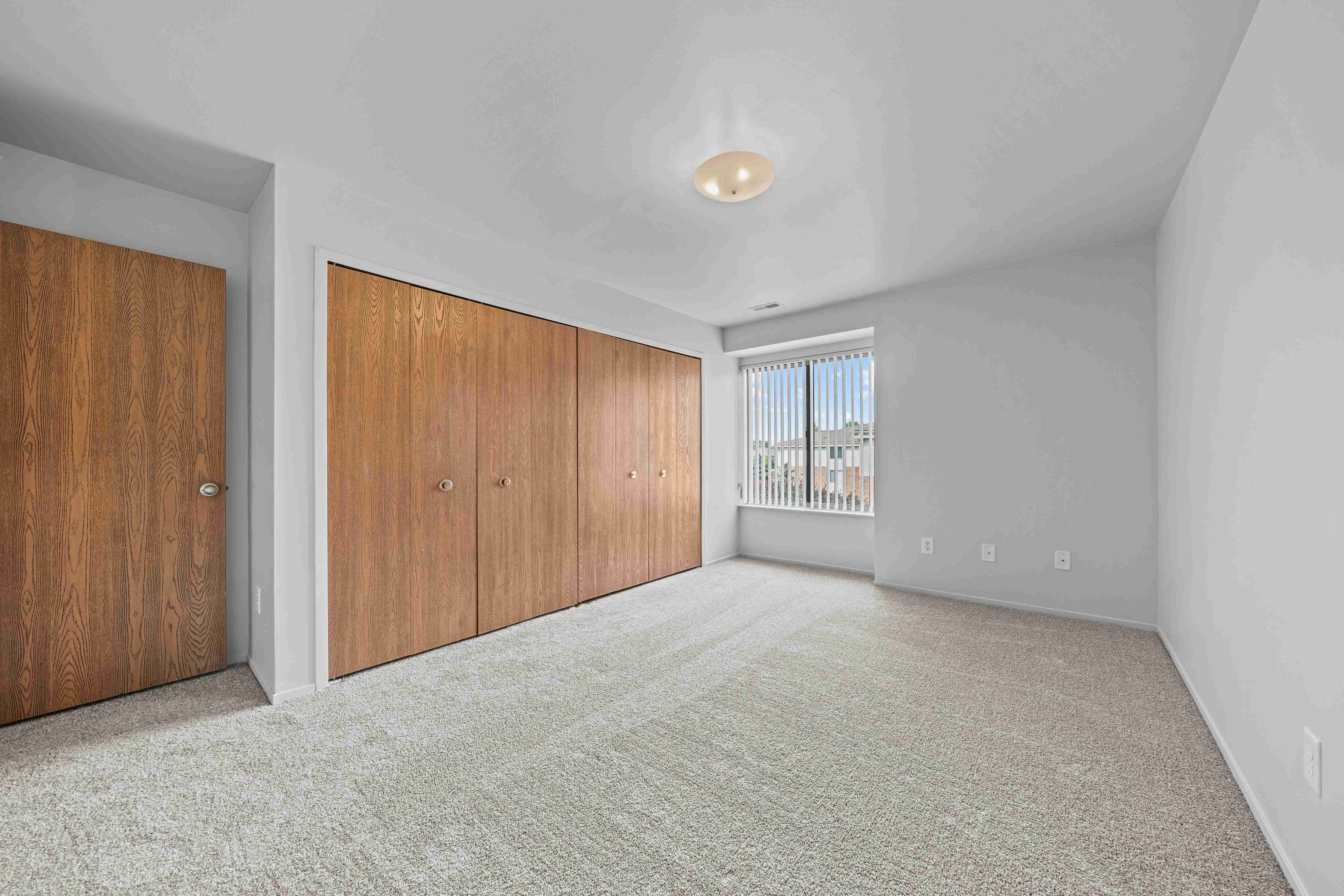 Bedroom with Ample storage space at Prentiss Pointe Apartments in Harrison Township, MI