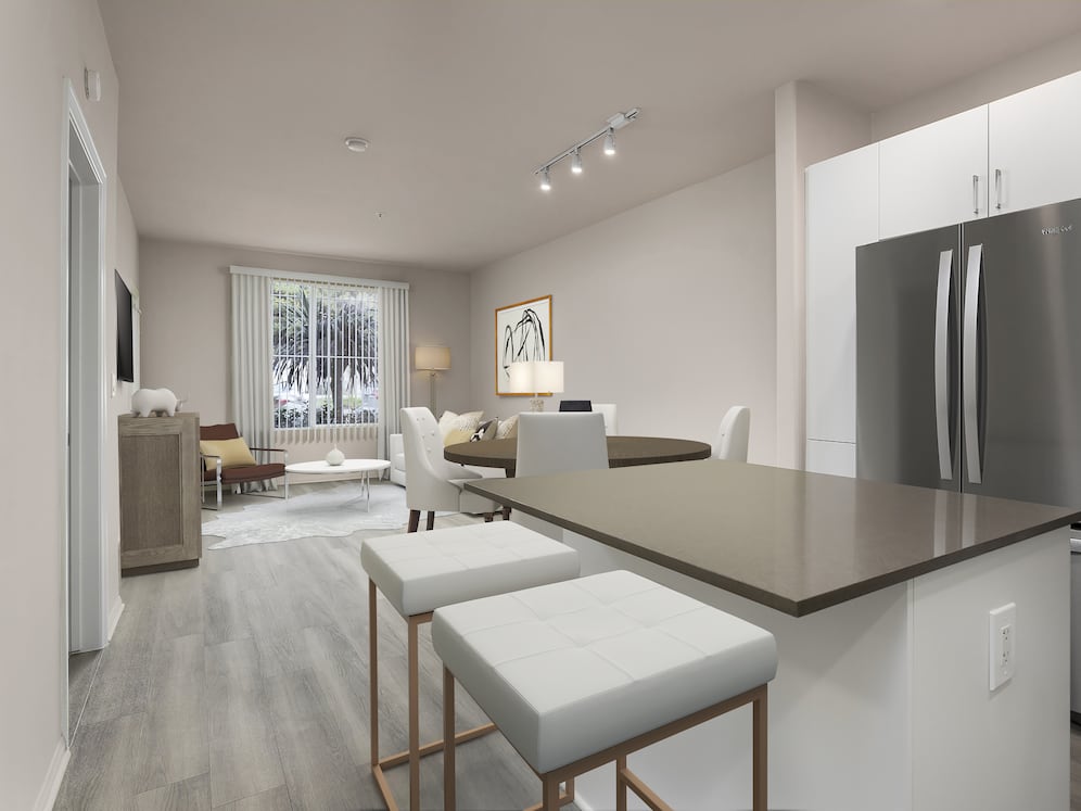 Renovated Package I kitchen with quartz countertops, white cabinetry, stainless steel appliances, hard surface vinyl plank flooring, and tile backsplash