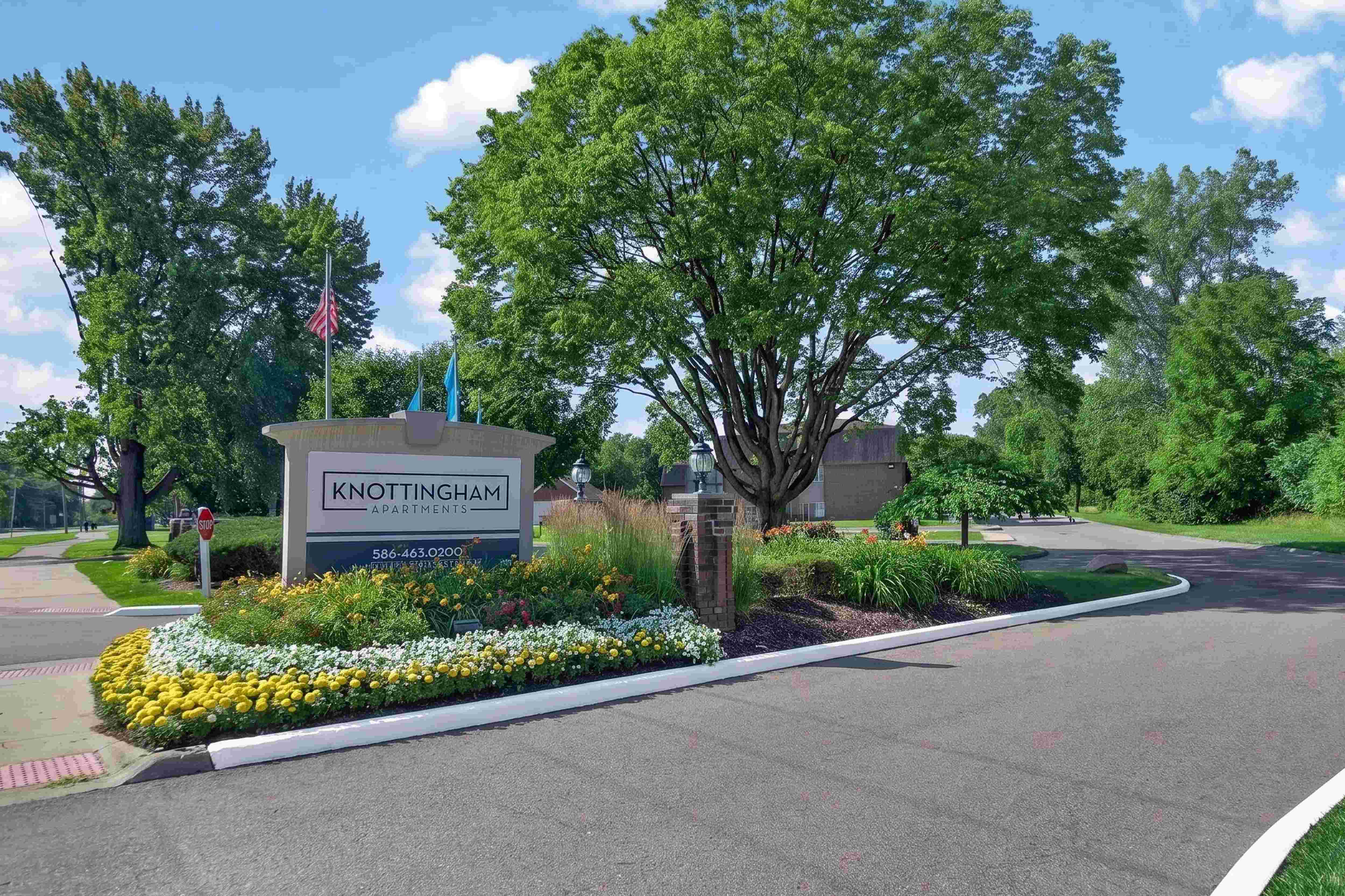 Welcoming entrance at Knottingham Apartments in Clinton Township, MI.
