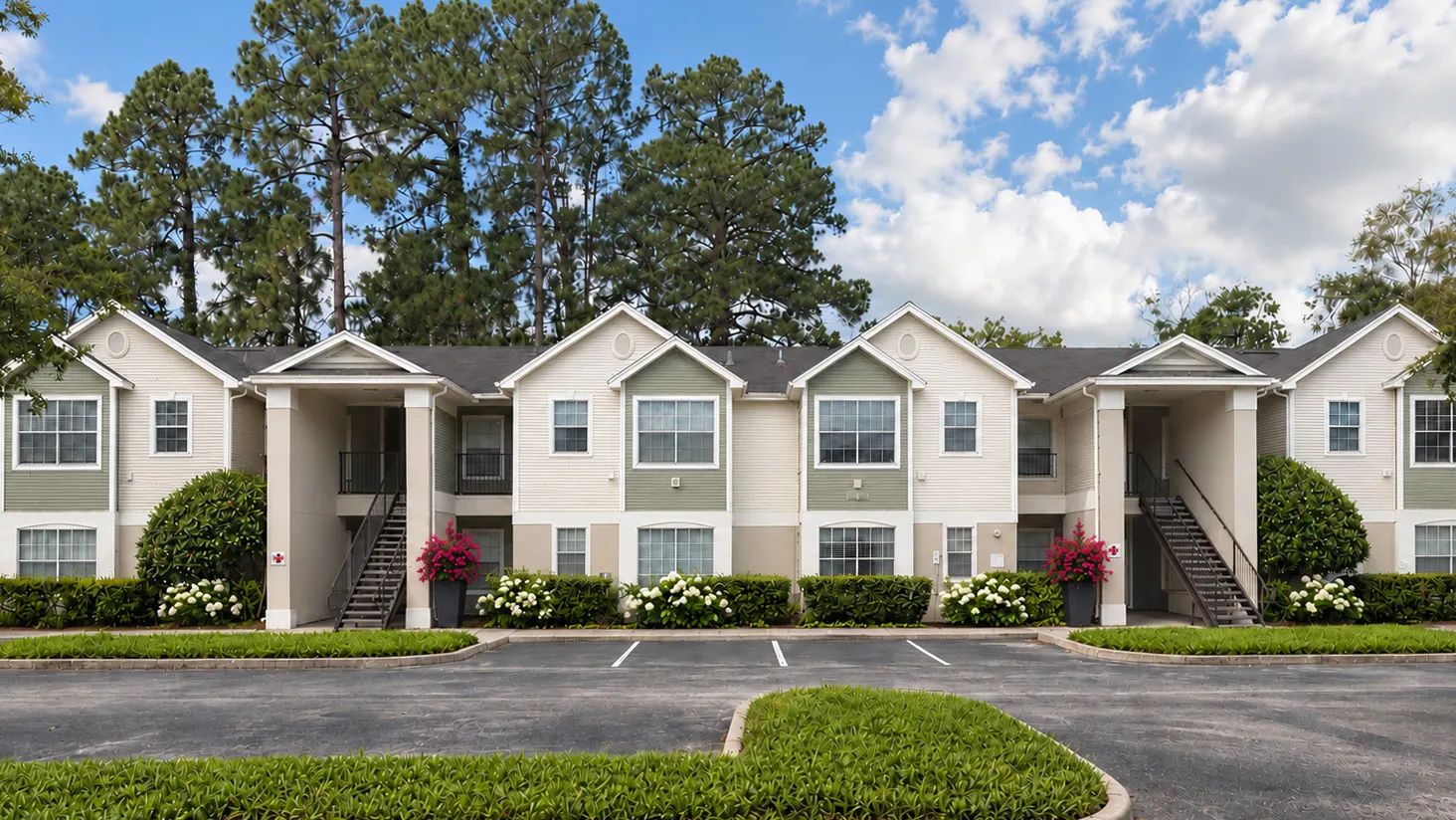 Discover the inviting atmosphere of Indigo Isles, where refreshed building exteriors, lush landscaping, and mature trees create a welcoming place to call home.