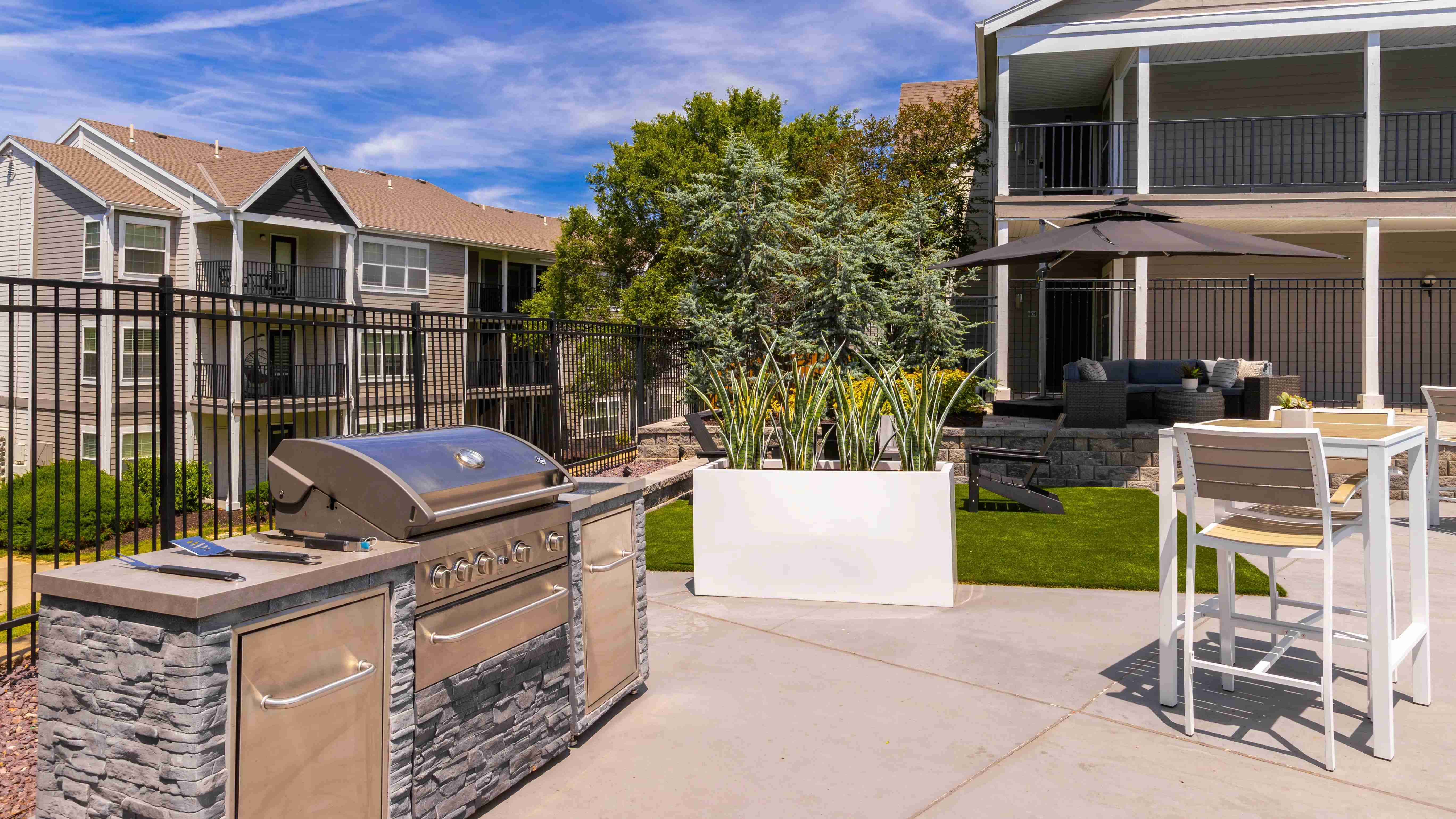 Enjoy outdoor cooking at our poolside grilling station, perfect for hosting barbecues and gatherings. Surrounded by lush greenery and modern seating, it's an ideal spot for relaxation and socializing.