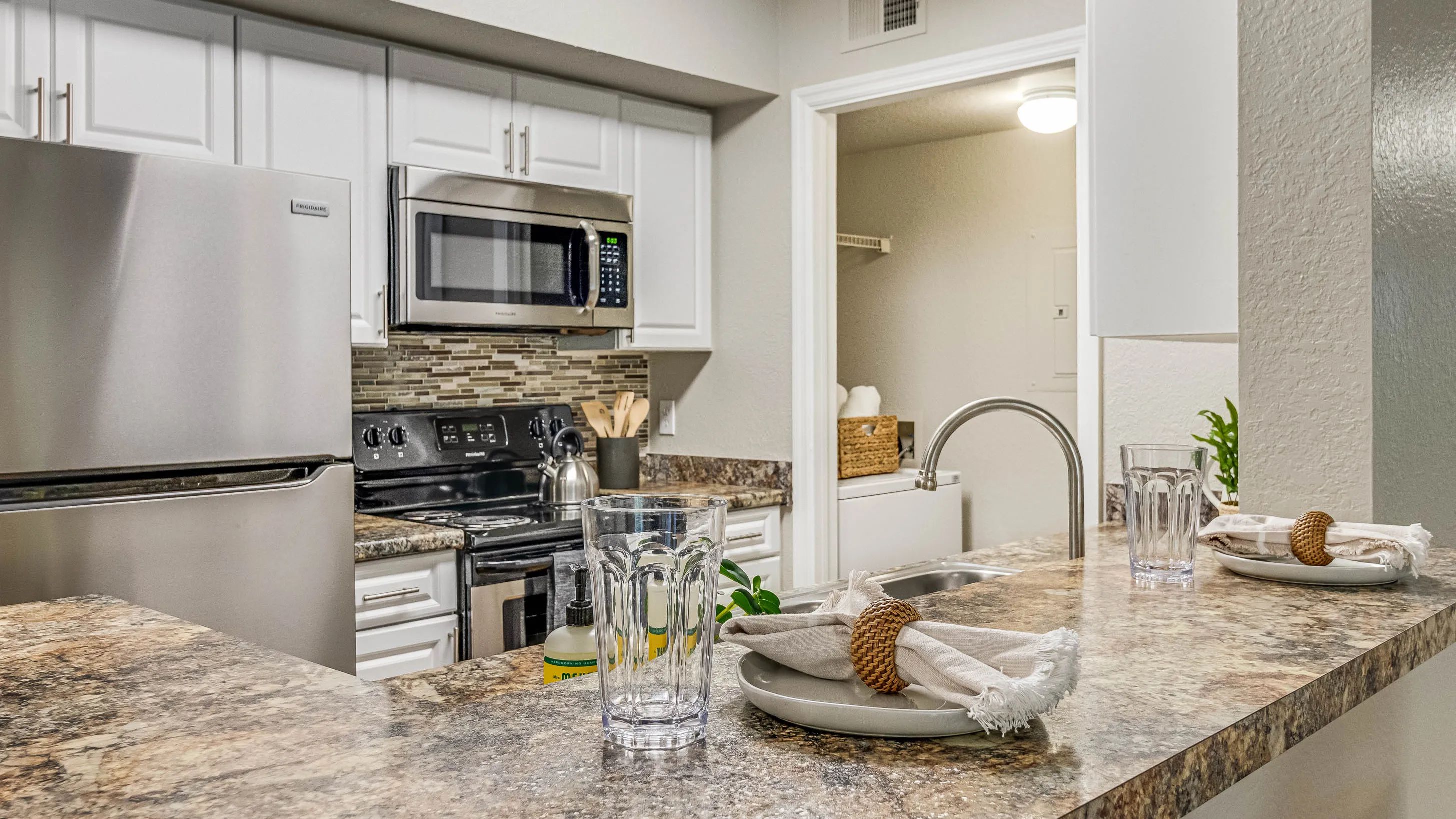 Our contemporary kitchens boast a breakfast bar perfect for casual dining or entertaining and convenient laundry access. 