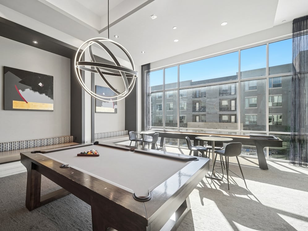 Game room with shuffleboard and billiards