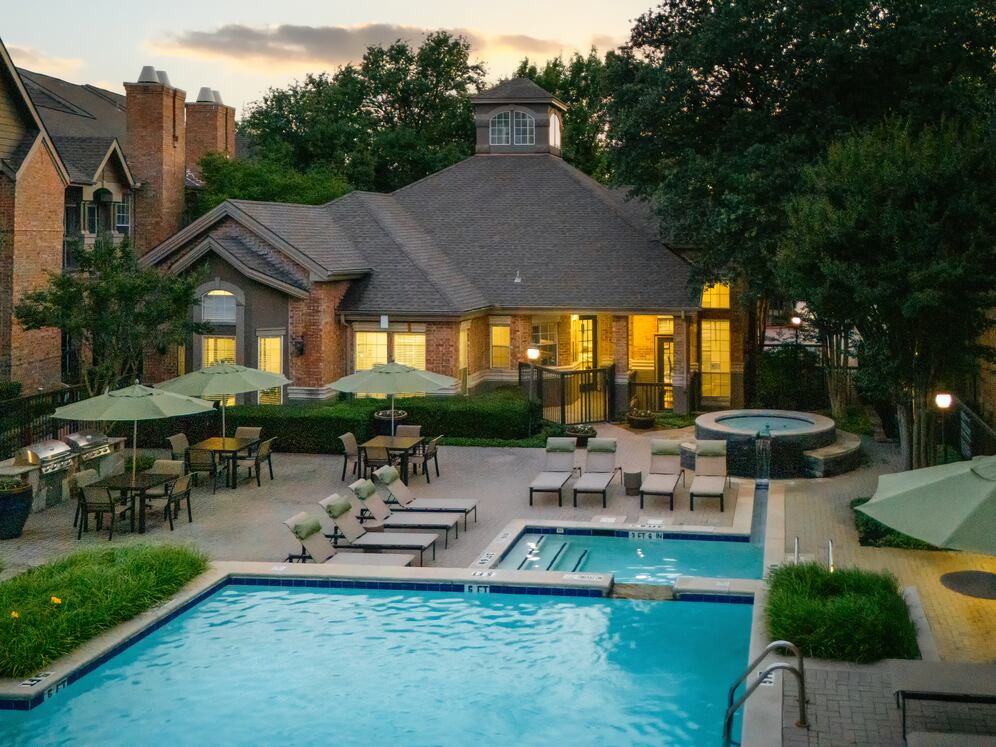 Swimming pool and sundeck with picnic tables