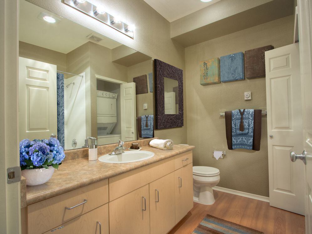 Classic Package I bath with laminate countertop, oak cabinetry, and hard surface flooring