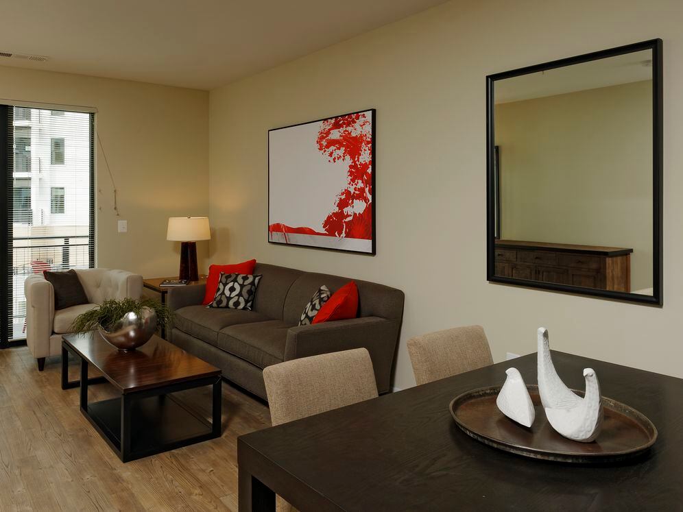 Contemporary dining and living area with hard surface flooring