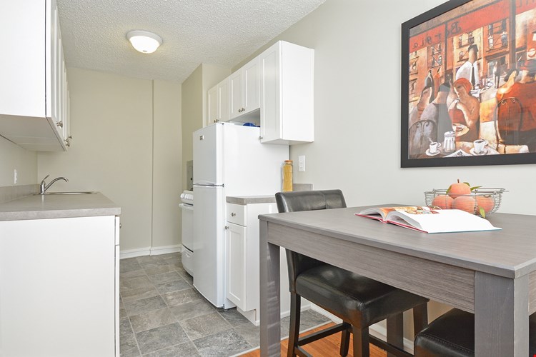 Sample Kitchen/Dining Room at Suburban Court Apartments