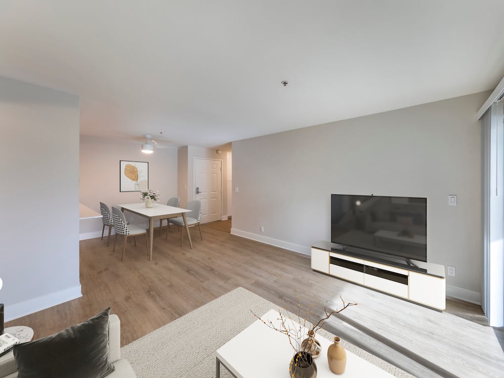 Renovated Package I dining and living room with hard surface flooring