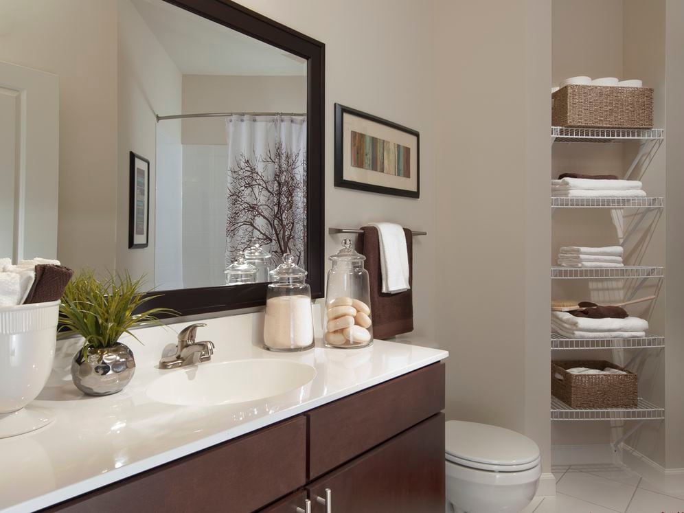 Bathroom with European-style cabinets, white countertop and hard surface flooring