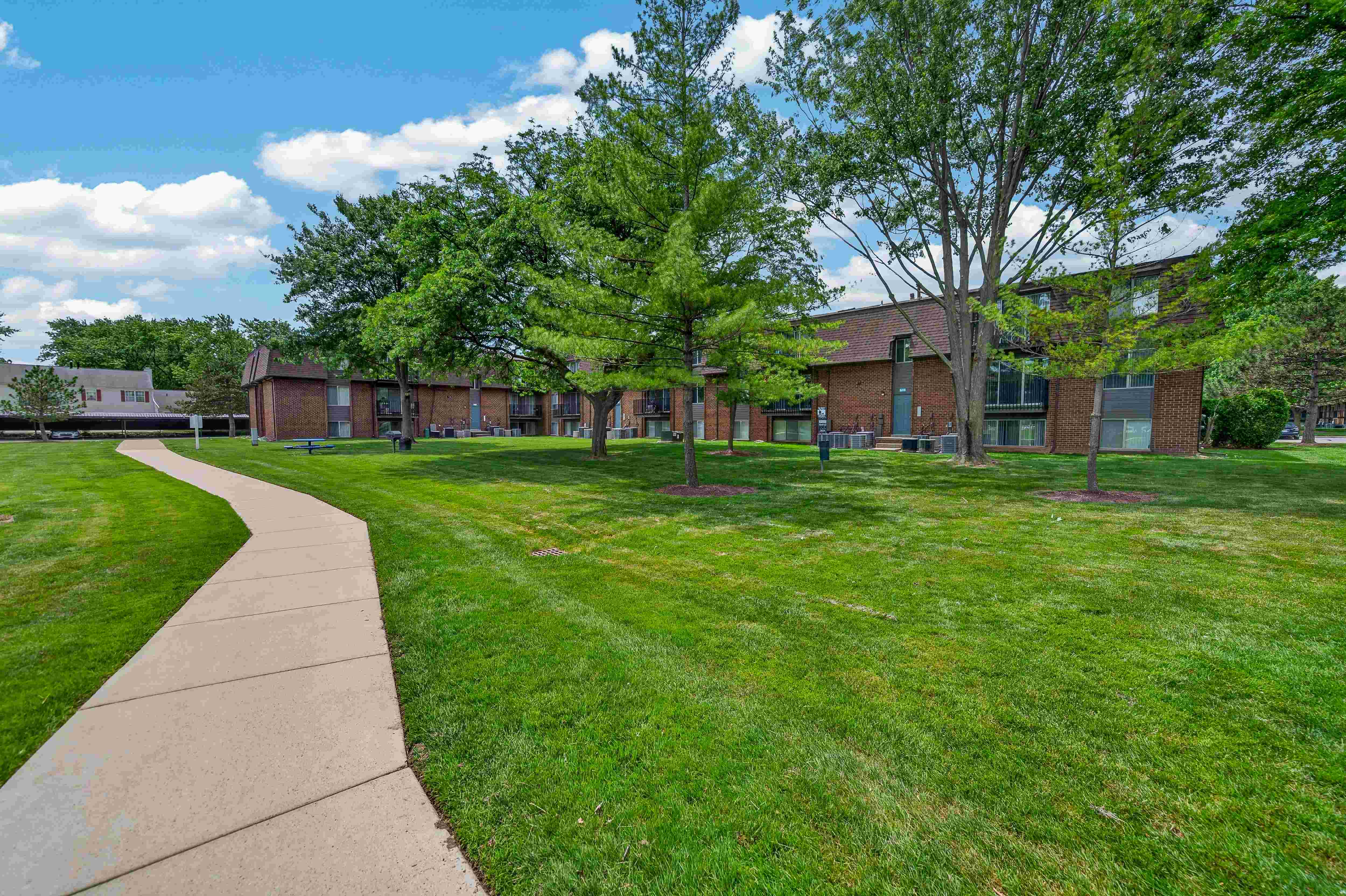 Expansive green space at Drawbridge Apartments in Harrison Township, MI.