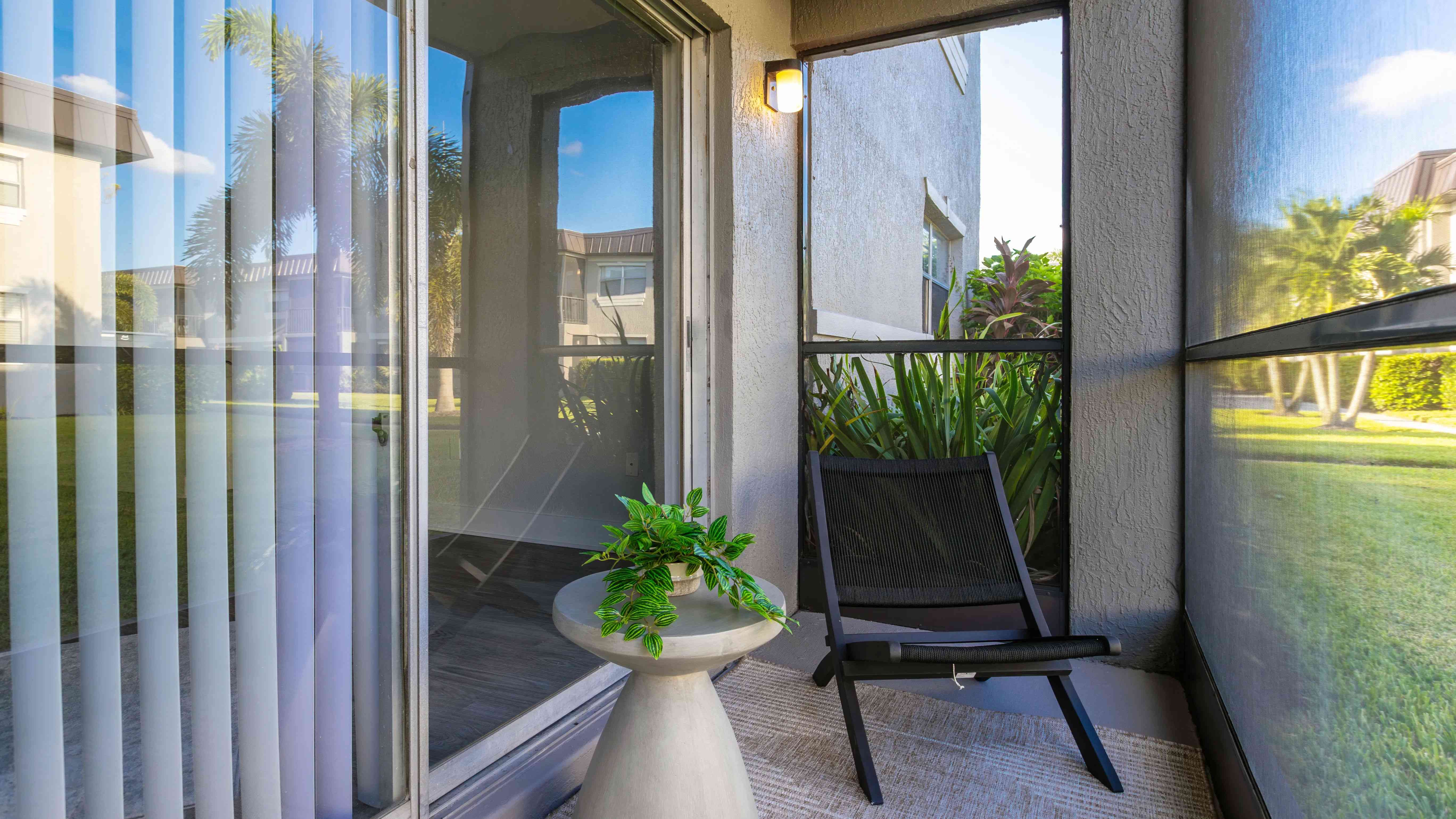 Relax in your private screened patio, perfect for enjoying peaceful garden views and Florida’s beautiful weather. This tranquil space is an ideal extension of your home for relaxation or outdoor dining.