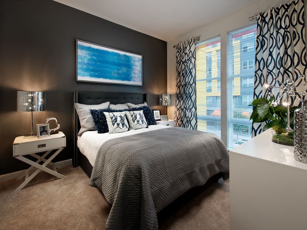 Bedroom with carpet and accent wall