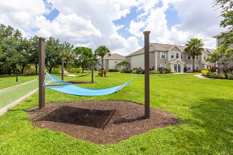 Soak in the sun on one of our hammocks at our hammock garden.