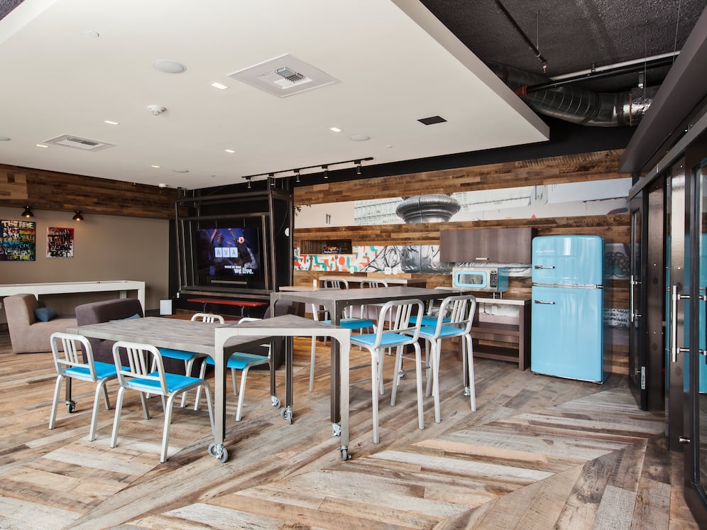 Chill lounge with entertaining kitchen, flat screen televisions and common area seating