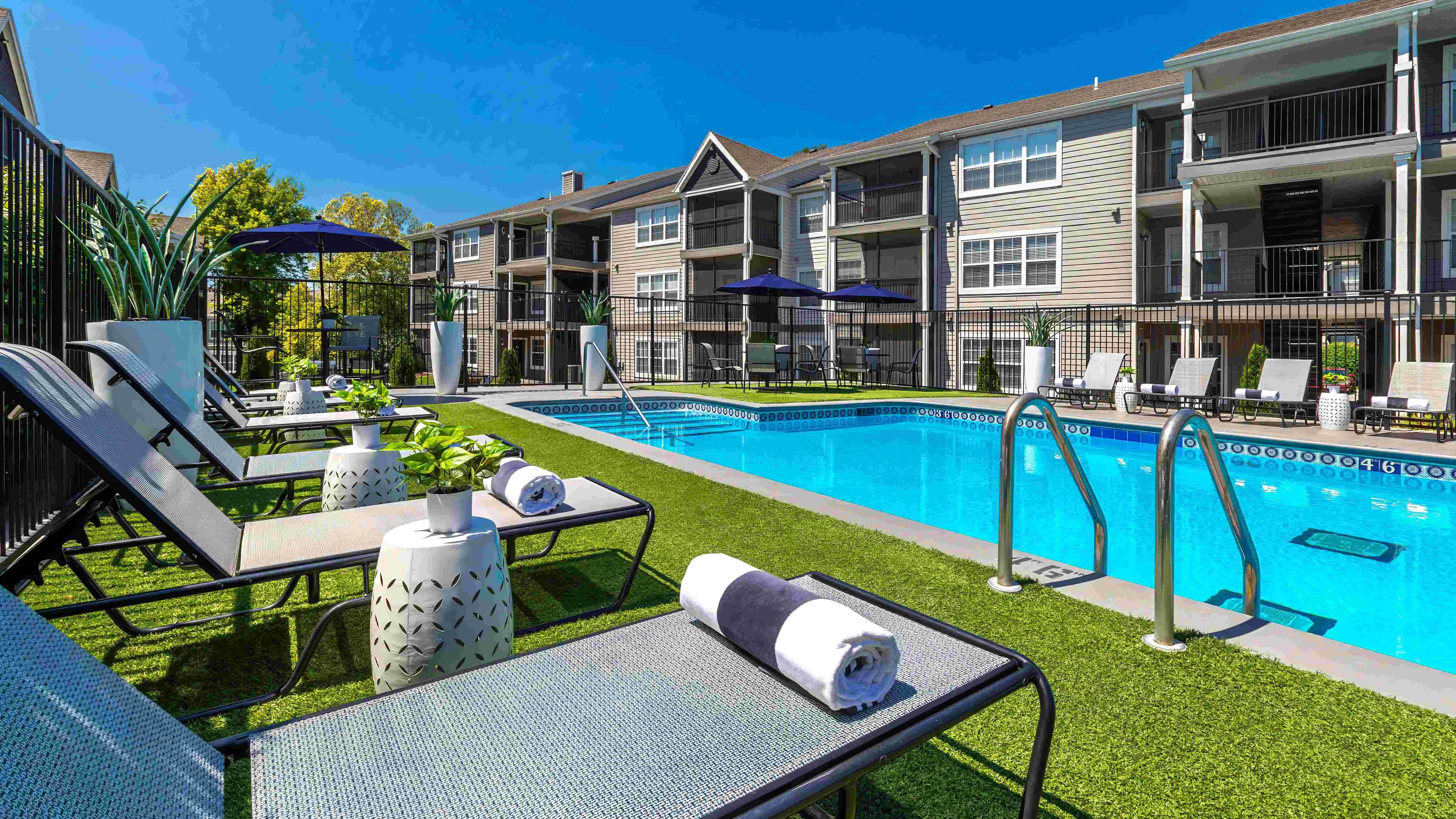 Relax in style on our poolside loungers and savor the sunshine.