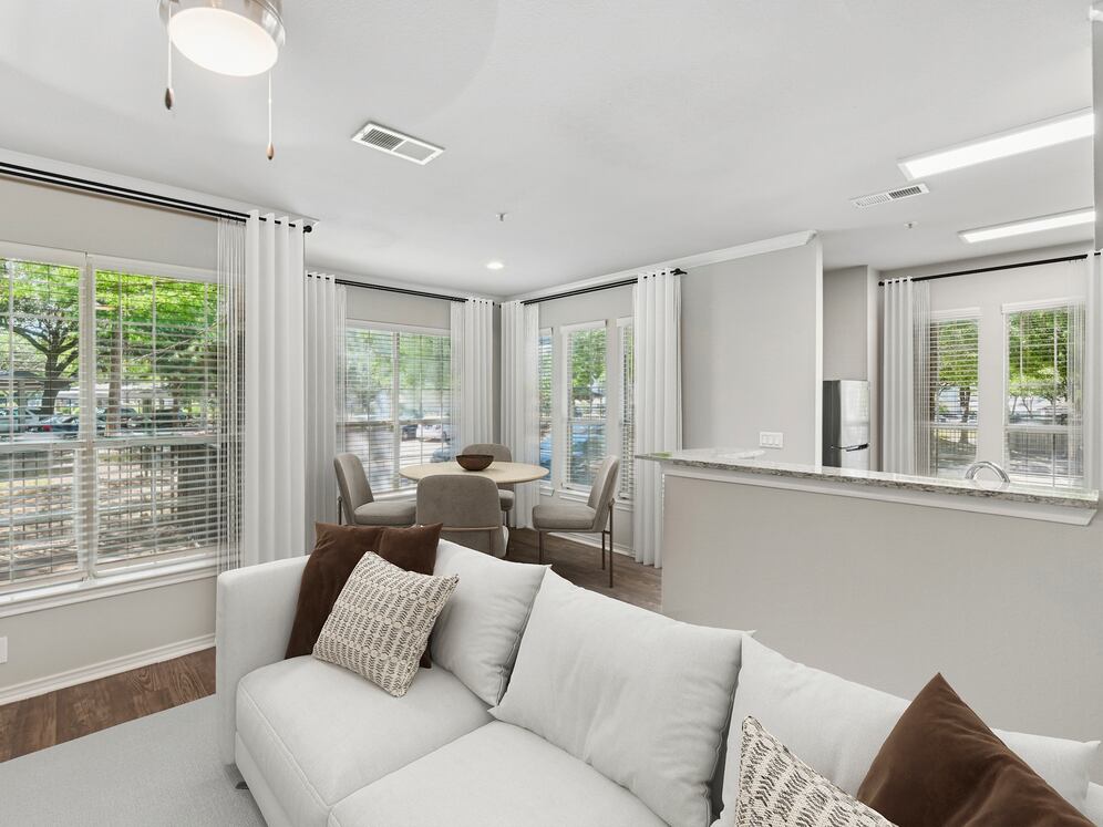 Classic Package II living and dining area with hard surface flooring (select homes)