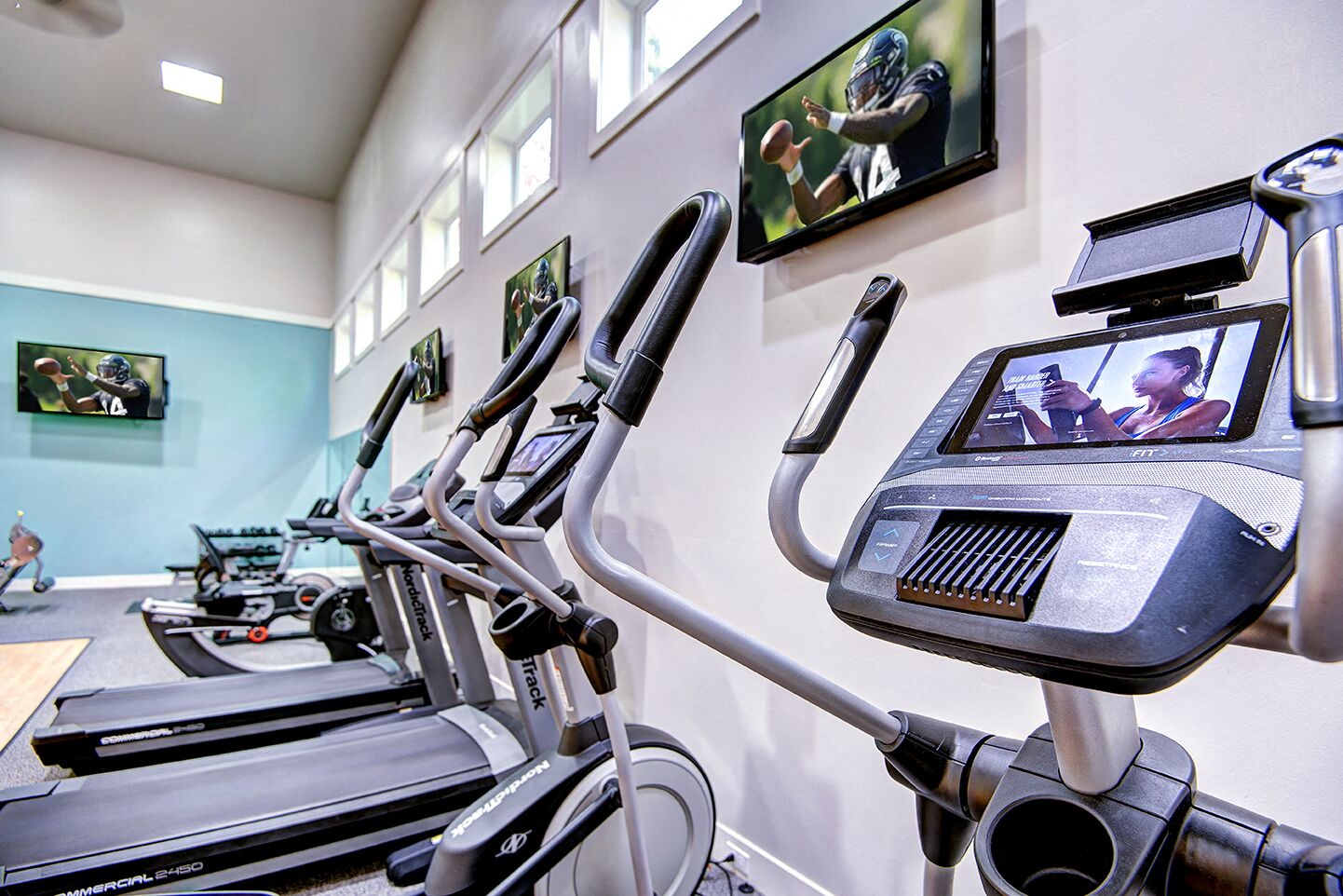 The Reserve at Bucklin Hill gym with treadmill and TV