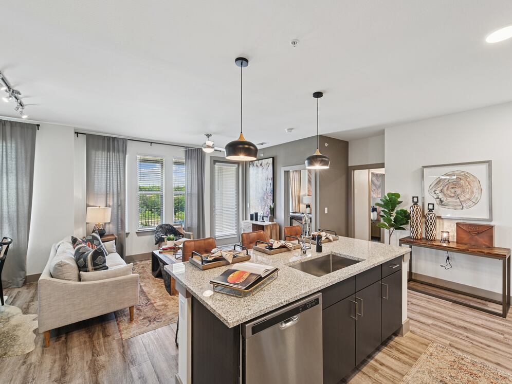 Kitchen and living room with hard surface flooring