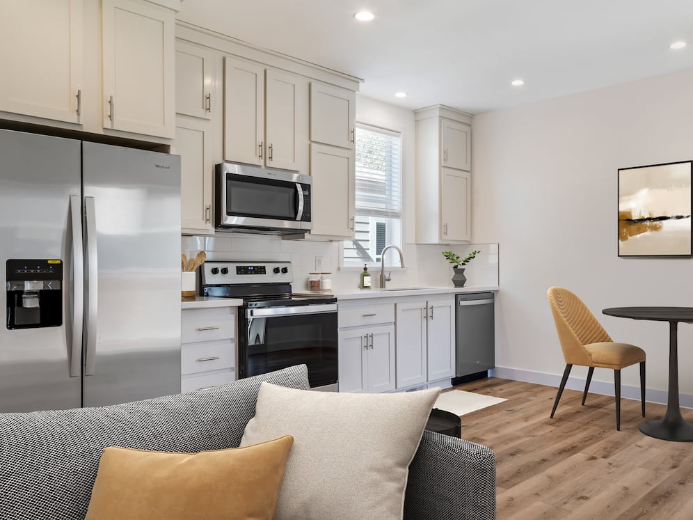 Freestanding Home kitchen and dining room with hard surface flooring