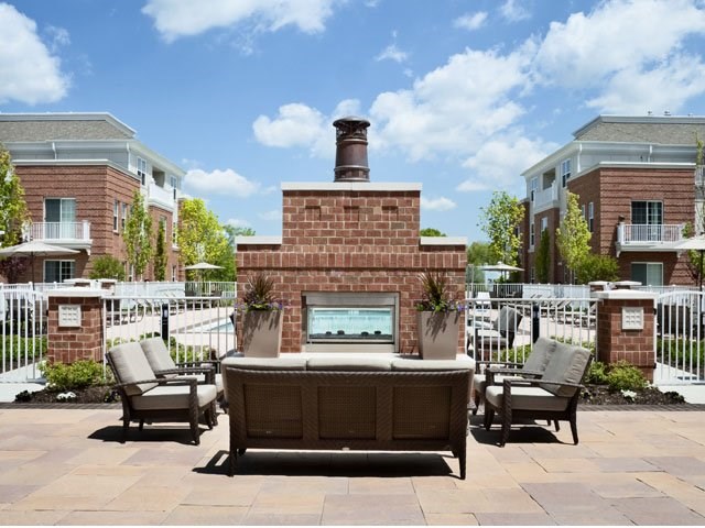 Unwind at the poolside fireplace and lounge area.