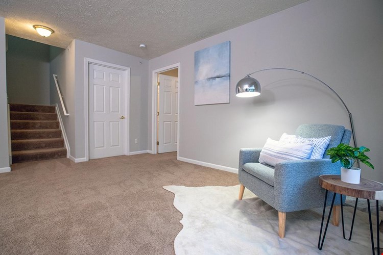 Spacious living rooms featuring large windows.