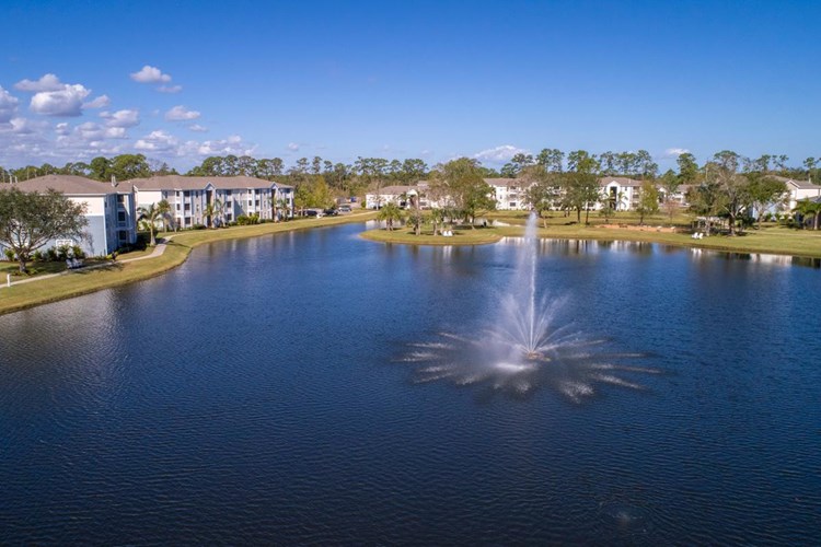 Residents of Grand Oaks enjoy strolling on our walking paths around the lake!