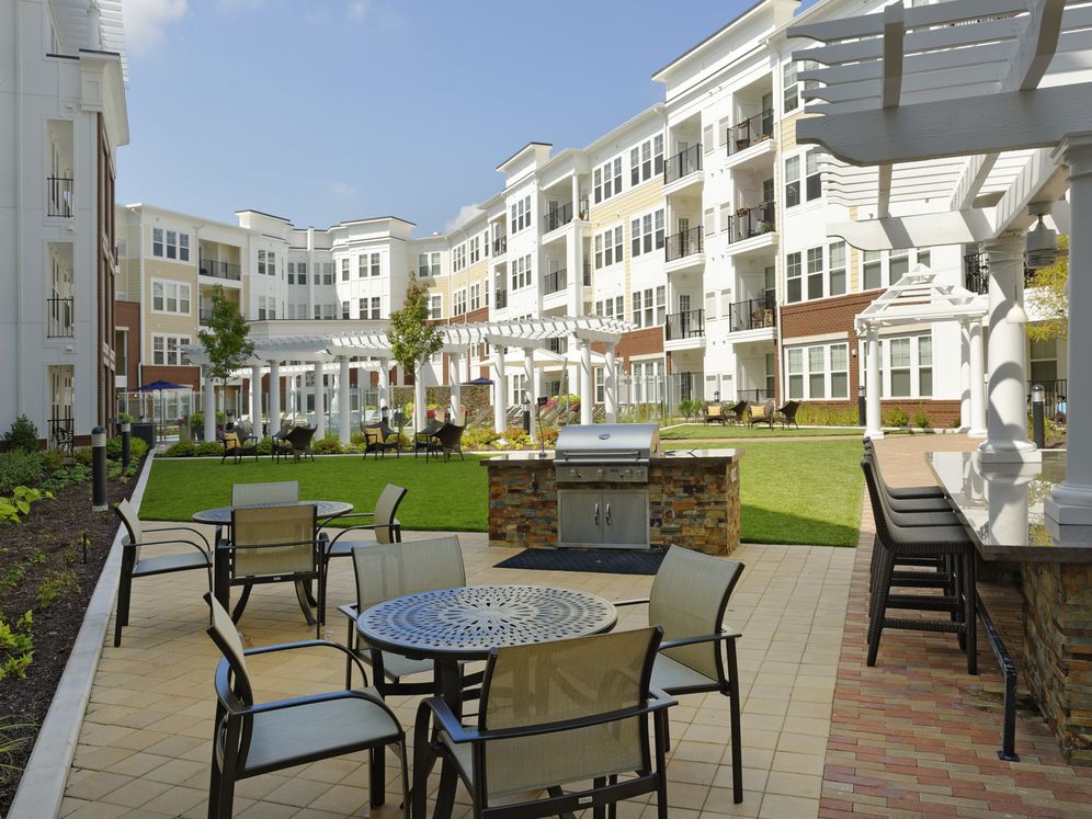 Courtyard with barbecue grill and dining area