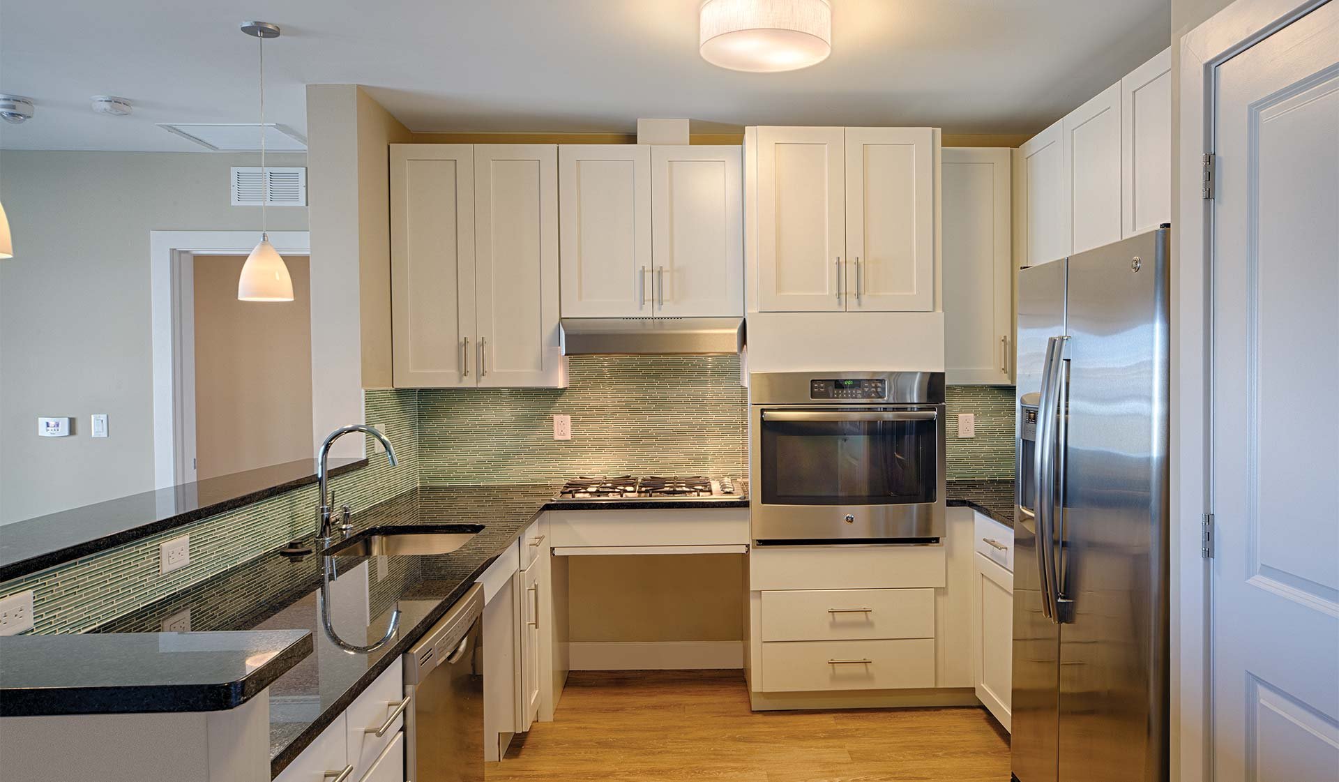 Select kitchens feature granite countertops, stainless steel appliances, designer cabinets, and a convection oven