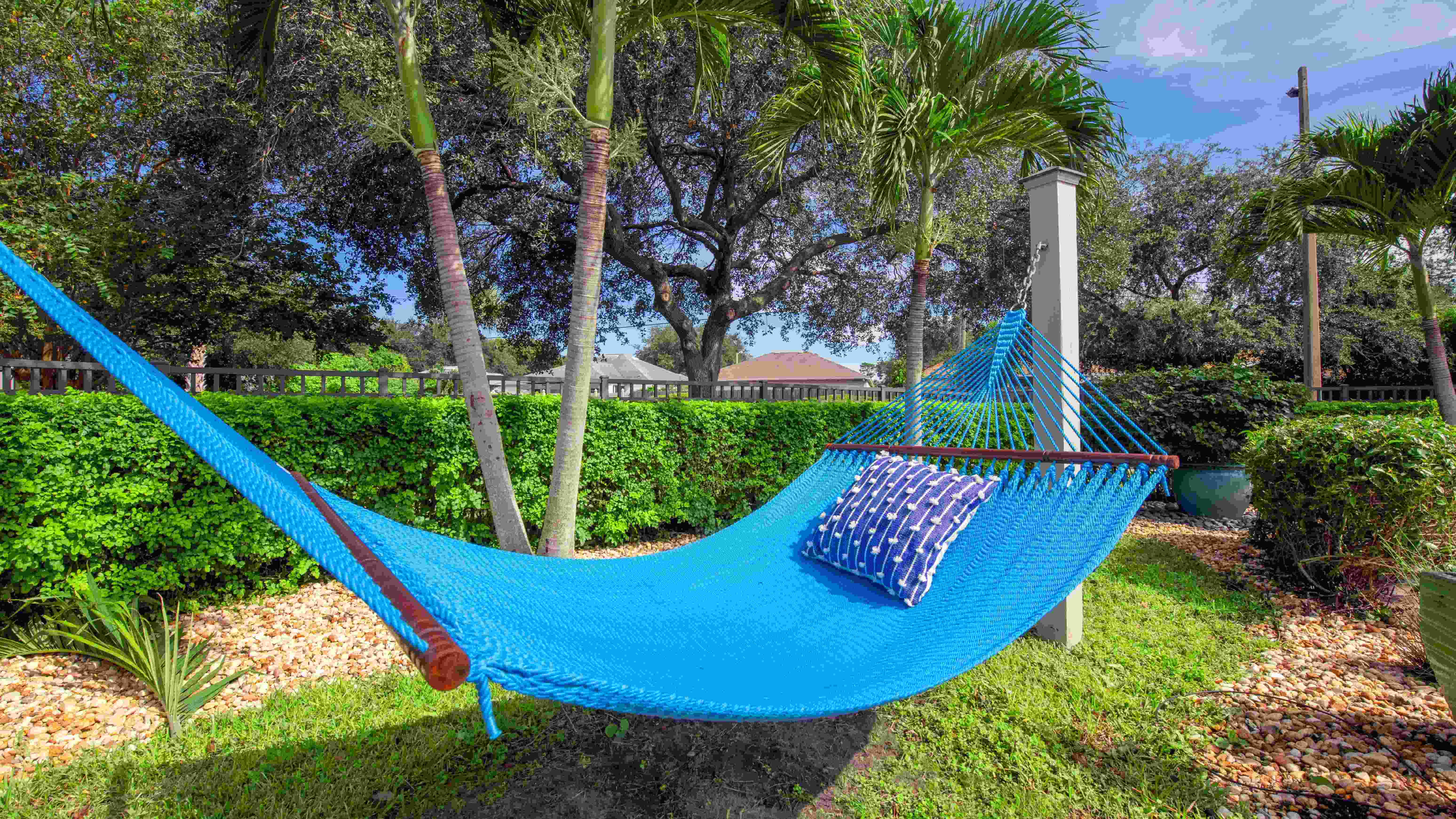 Drift away in a blissful hammock cocoon, nestled under swaying palms and kissed by the warm Florida sun.