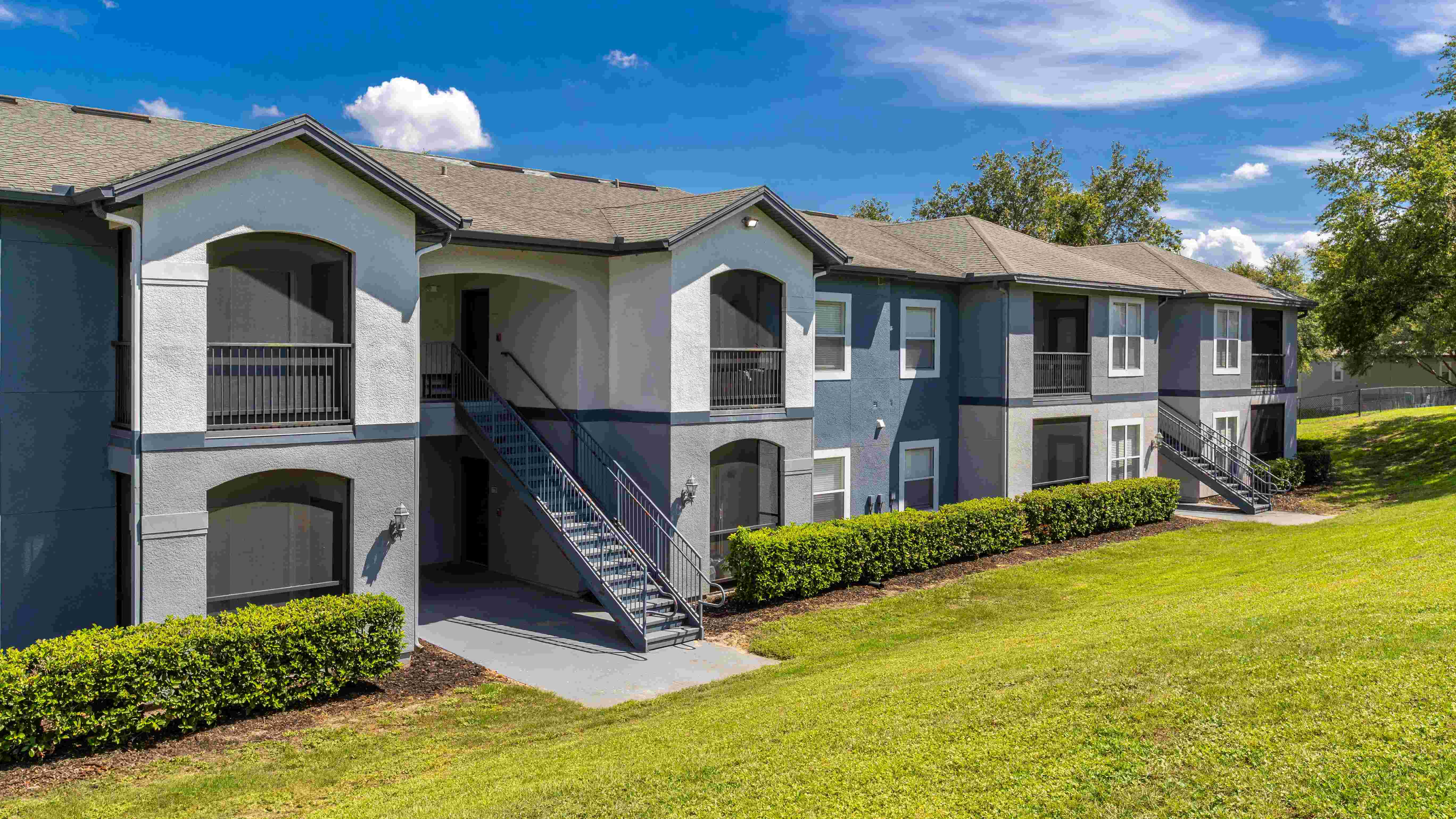 Discover the contemporary charm of Elevate 155 with freshly painted exteriors, private screened-in patios, and lush green surroundings.