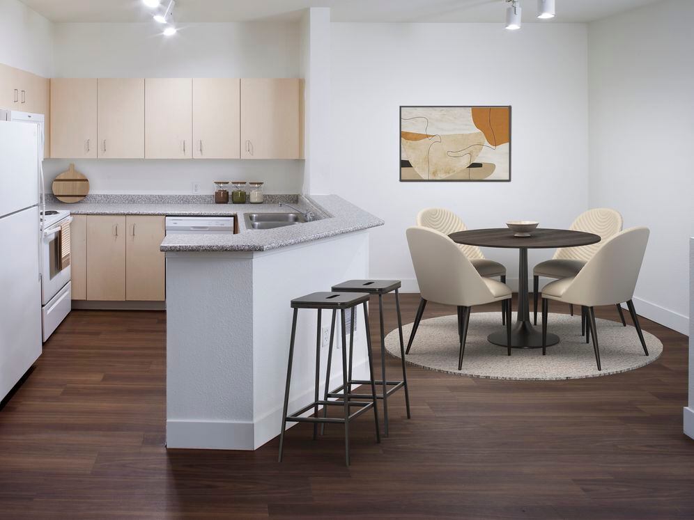 Kitchen and dining room with hard surface flooring (select homes)
