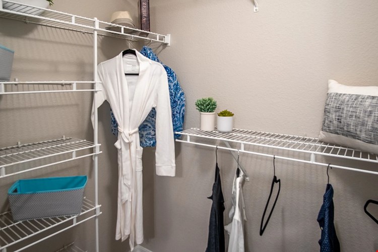 Organize in style with Eagle's Pointe walk-in closets. Abundant built-in open wire organizers ensure your clothing is always ready to impress.
