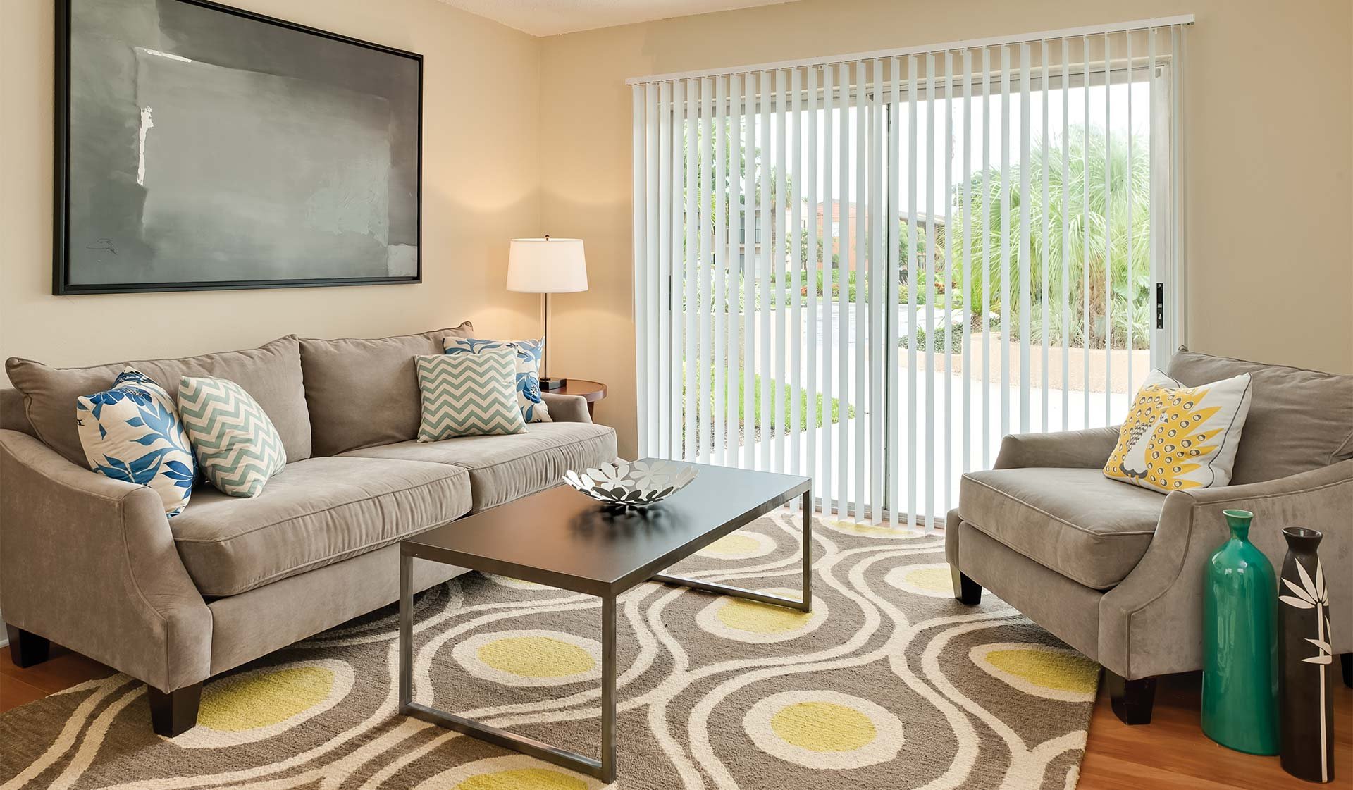 Open living and dining areas with a private balcony