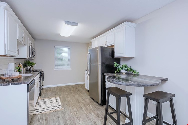 Kitchens feature a breakfast bar.