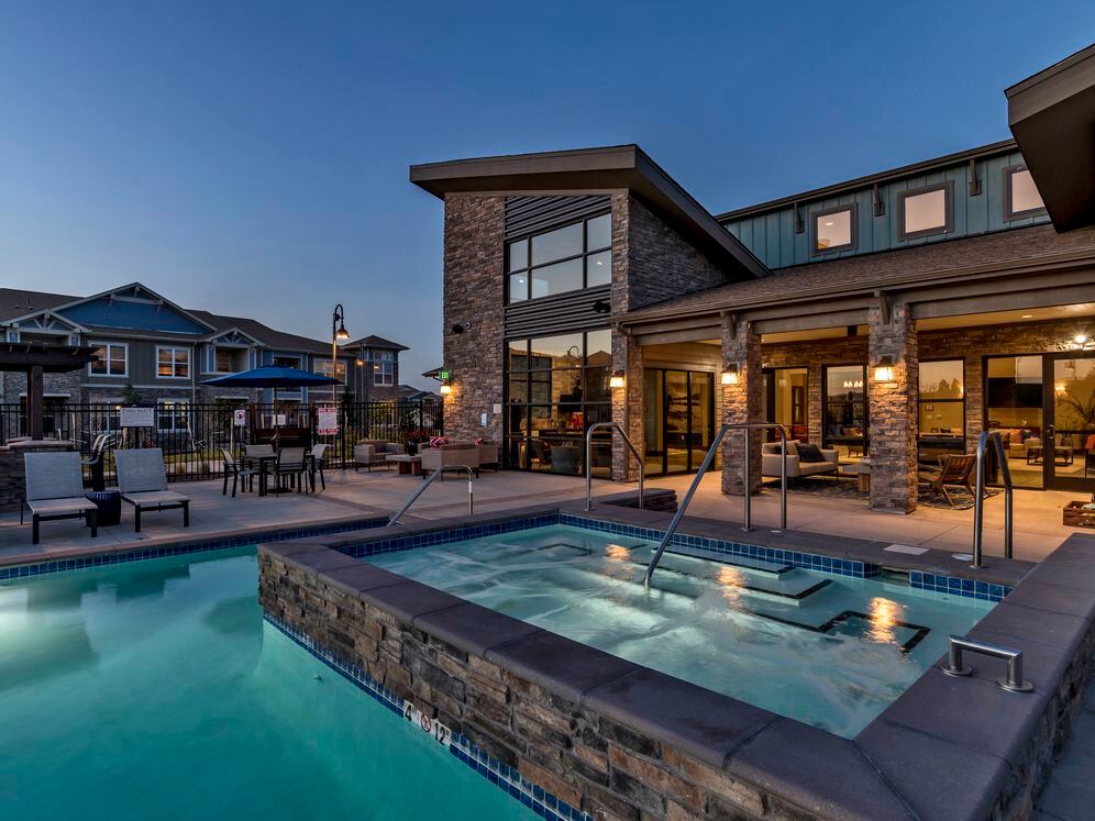 Outdoor lounge with swimming pool, spa and sundeck with lounge seating