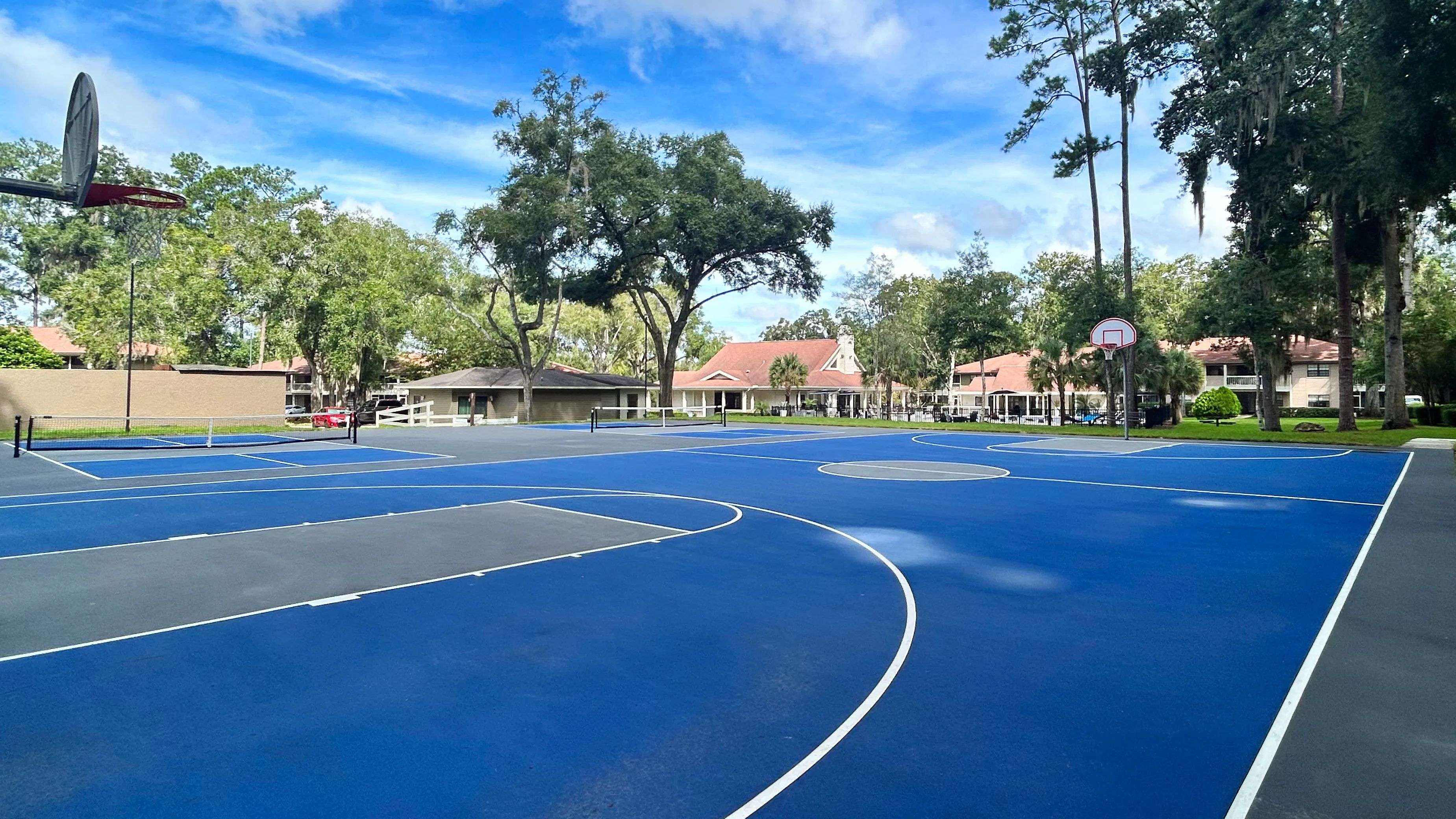 Stay active without leaving the community at Carrington Lane's multi-use sports court, featuring dedicated areas for both basketball and pickleball.