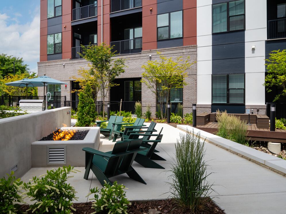 Courtyard #1 with firepit, lounge seating, and BBQ grills