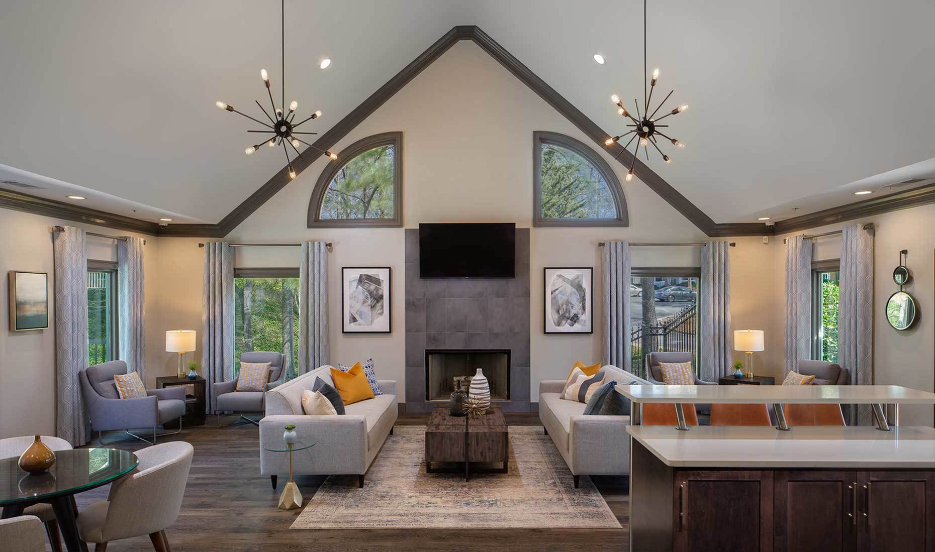 Modern clubroom with fireplace, coffee bar and computer area