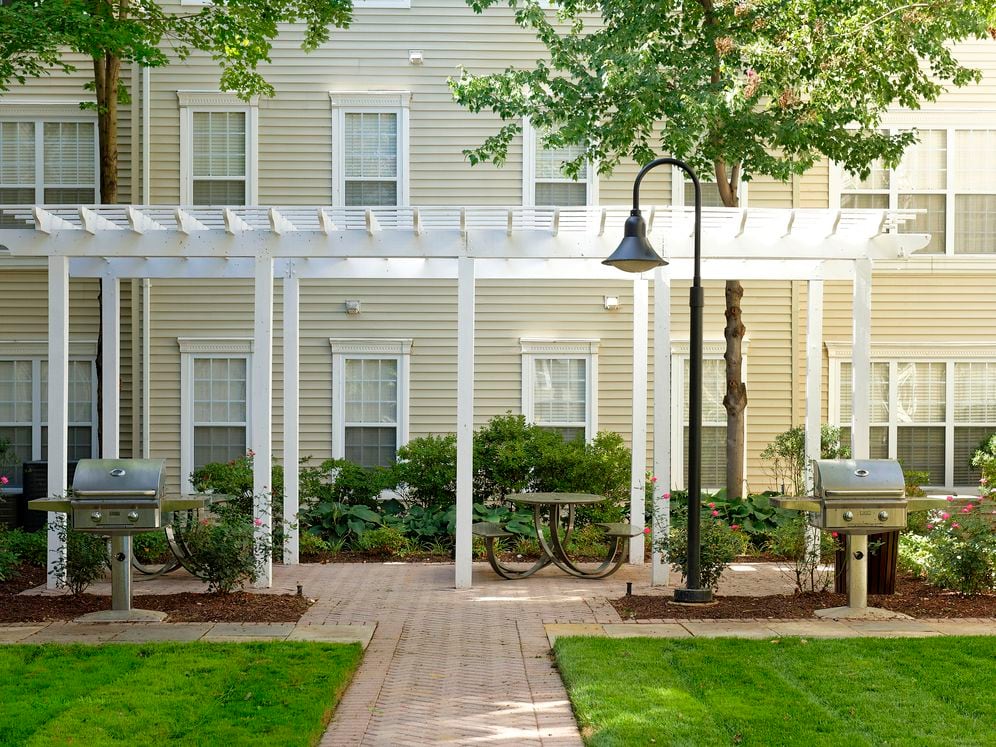 Courtyard with barbecue grills and dining area