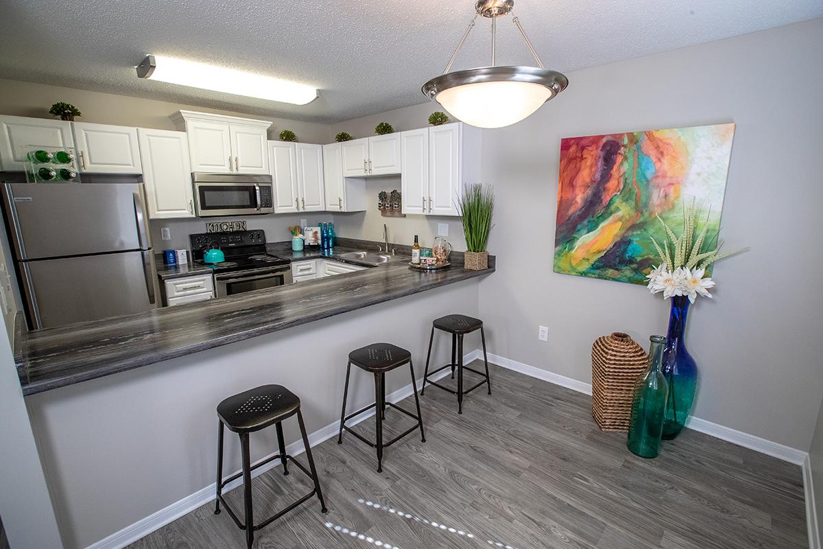 Kitchens feature a breakfast bar overlooking the separate dining area.