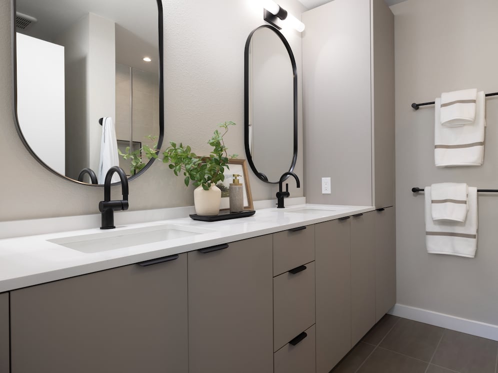 Signature Collection I 3-Bedroom Townhome Primary bathroom with light grey cabinetry, white quartz countertops, and tile flooring