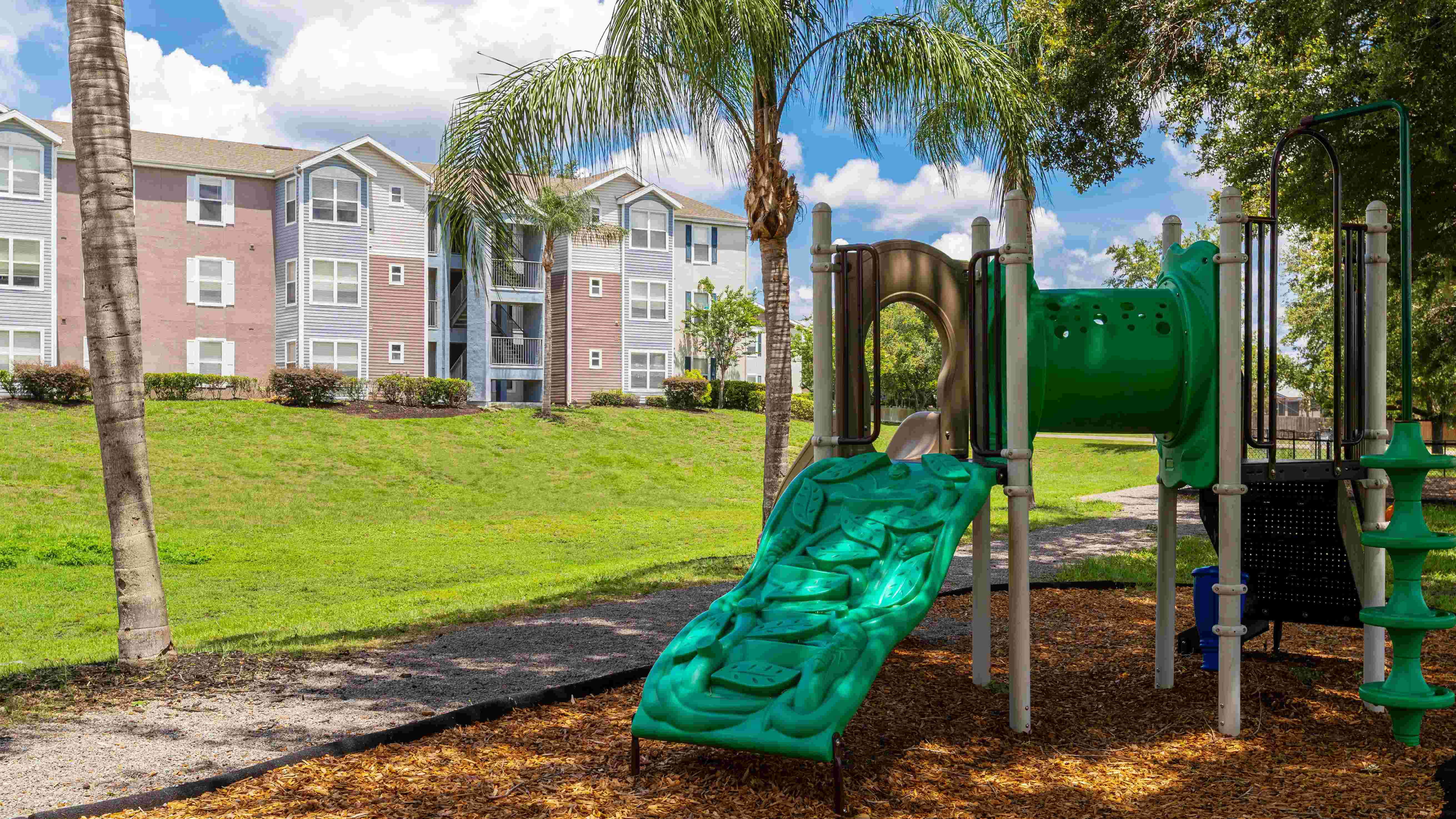 With palm trees and plenty of green space, our community playground is a fun and refreshing spot for kids to climb, slide, and explore.
