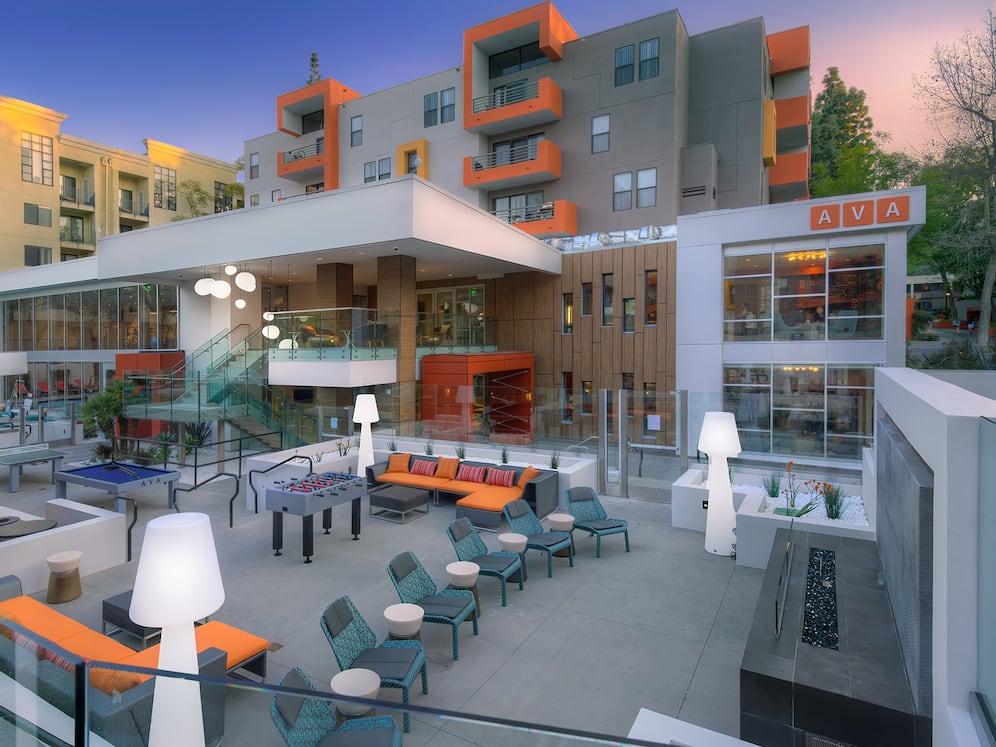 Outdoor Lounge with Seating Fire Pit and Game Tables